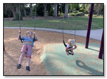 Arrow and Tiger on swings Mesa Park July 2019