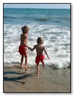 Tiger and Arrow holding hands at beach July 9 2020