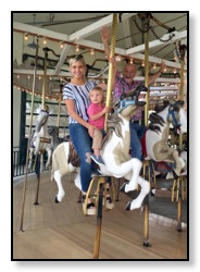 Melika, Tiger, Dan on Merry go round Sept 2016